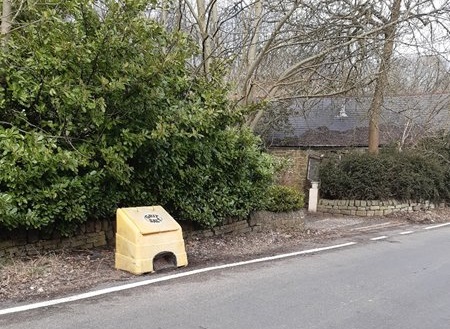 A grit bin on a pavement