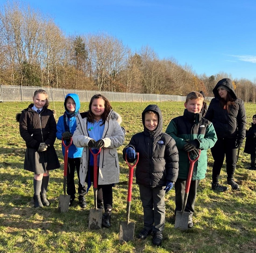 Pupils planting trees at Thornton Primary School.