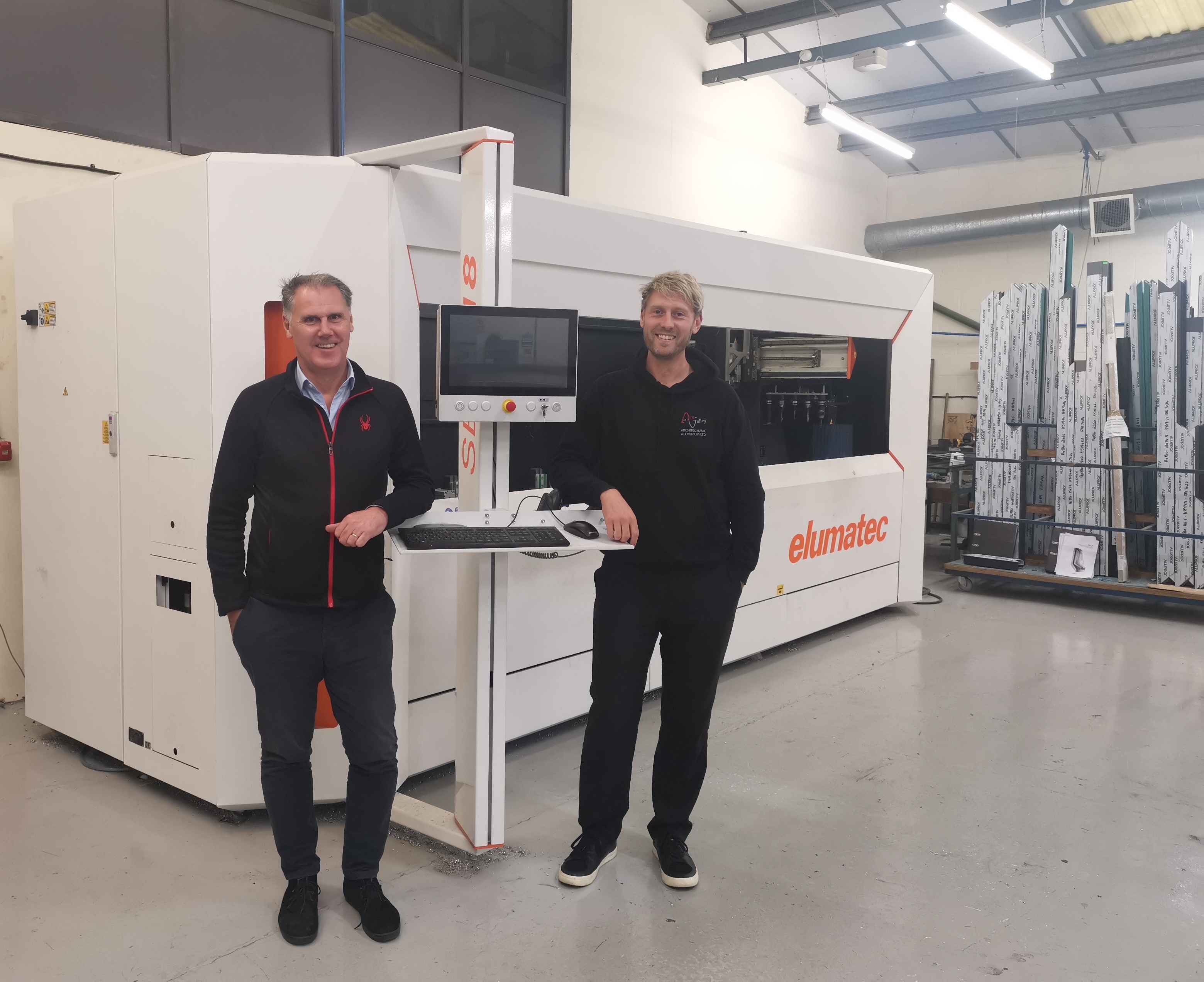 Aire-Valley Aluminium team, Stuart Parker (left) and Chris Kilvington (right). Two men standing in-front of the new machine.