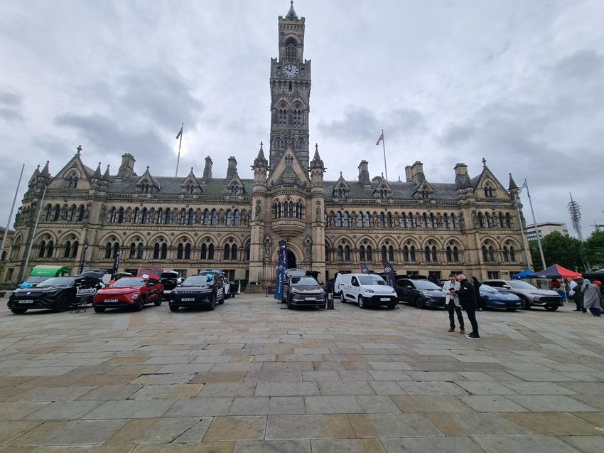 PlugIn Bradford District event in Bradford. City Hall is in the background with a number of cars in the foreground.