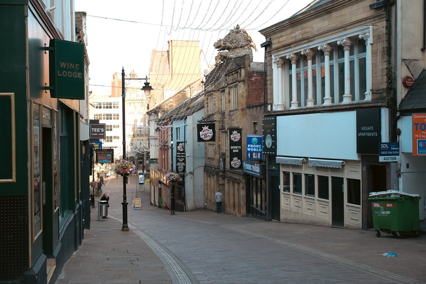 Ivegate in Bradford city centre, showing the shopfronts of various businesses.